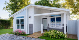Exterior of the Cottage Farmhouse home model at Silver Bay in Palatka, Florida.