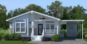Exterior of the Cottage Farmhouse manufactured home featuring white vertical siding, a gray gabled roof, and a covered front porch with dark railing.
