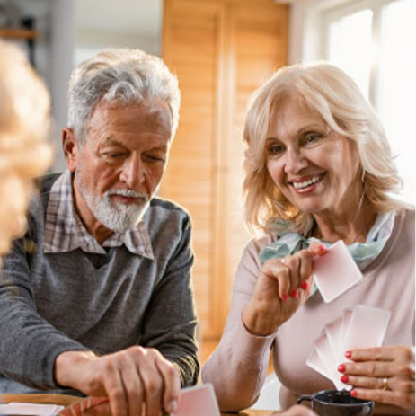 A couple of senior citizens playing cards