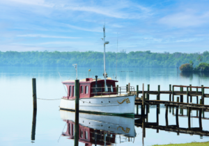 A white and red boat docked at st johns river