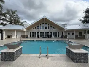 Silver Bay clubhouse and pool area with outdoor seating.