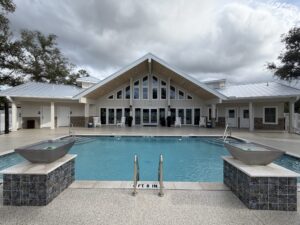 Silver Bay clubhouse and pool area with outdoor seating.