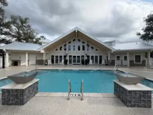 Silver Bay clubhouse and pool area with outdoor seating.